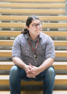 Indigenous Student Advisor sitting on staircase