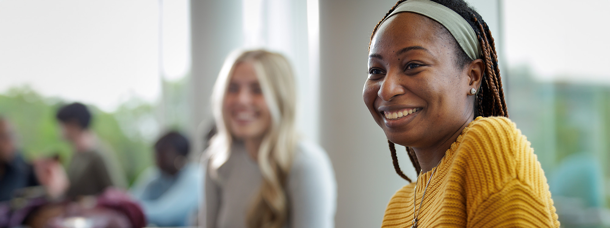 Two smiling students.