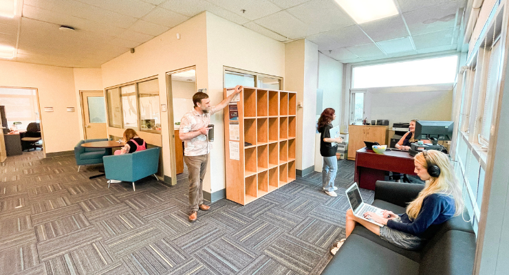 People standing and sitting in the main FSC office