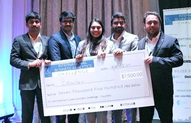 five international business analytics award students holding an oversized cheque for $7500